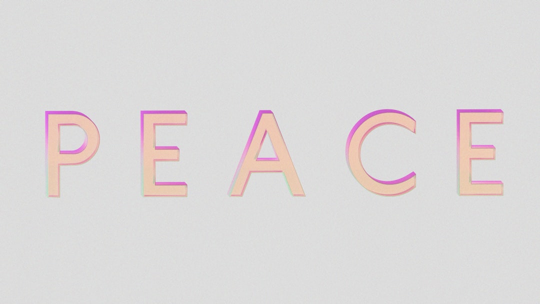 The word peace in pastel gradient letters.