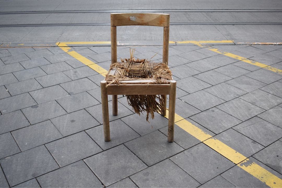 brown wooden chair on gray concrete floor