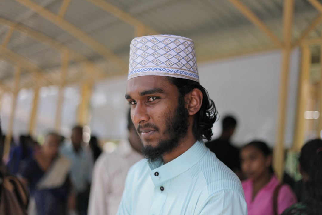 man in white button up shirt wearing white and black hat