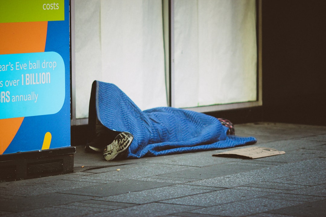 blue and white textile on brown wooden floor