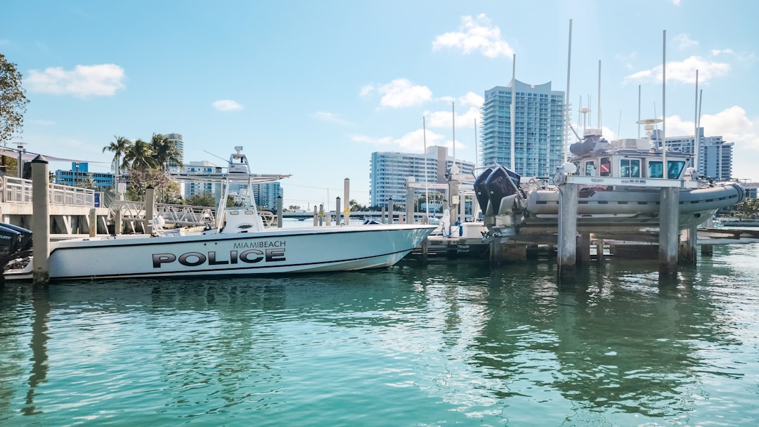 A boat is docked at a marina in a city