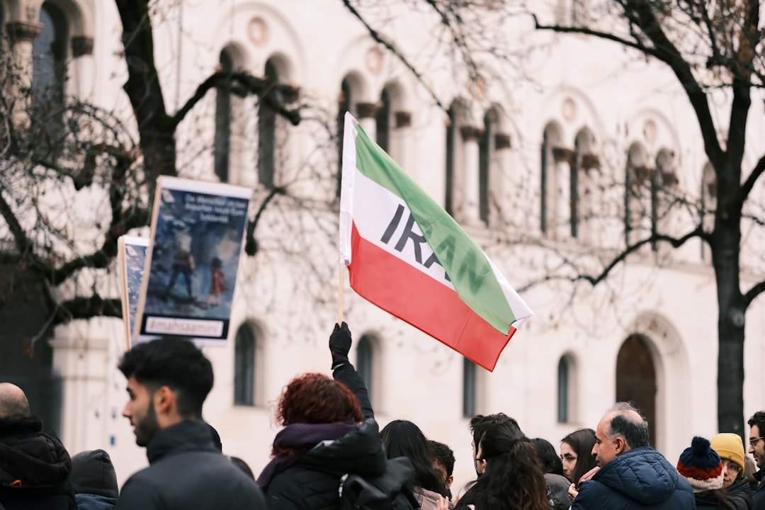 a crowd of people standing in front of a building
