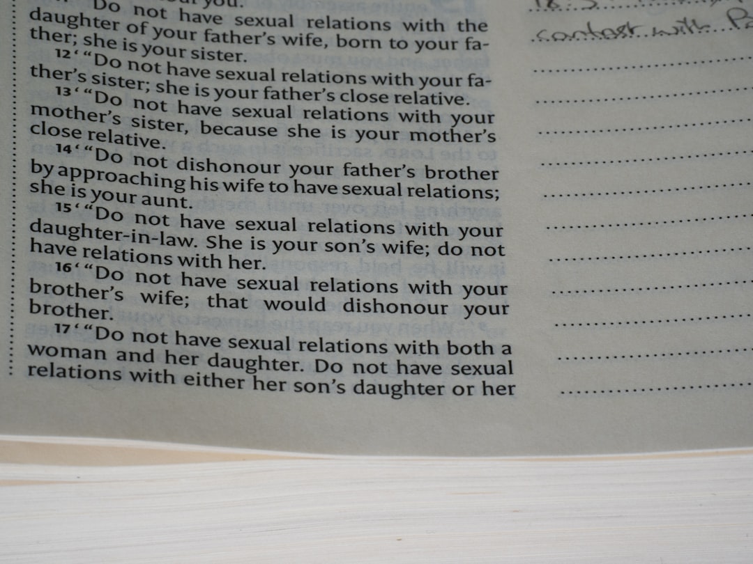 A book page with printed text and handwritten notes.