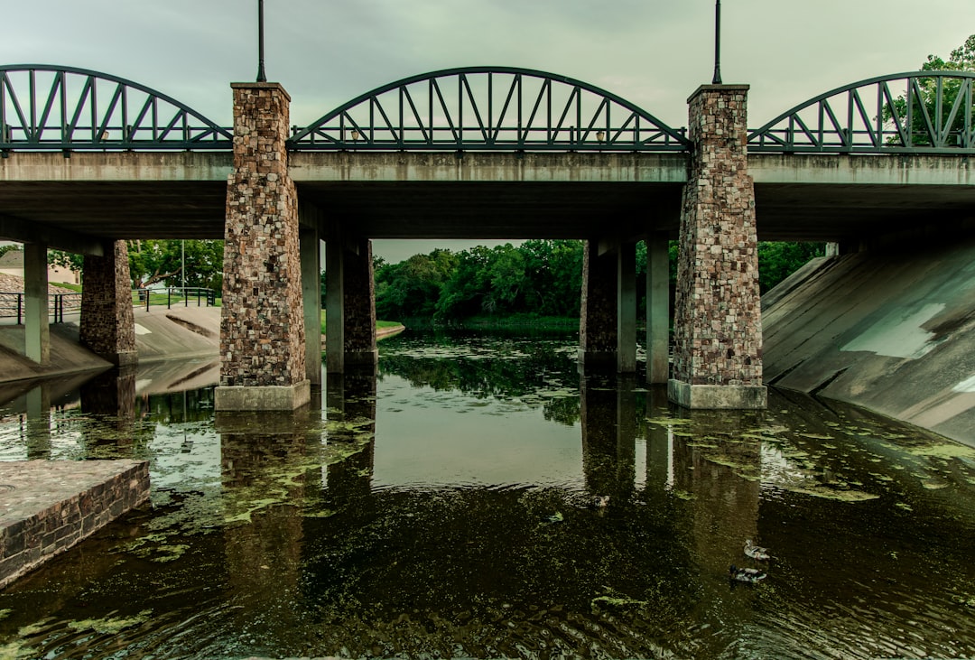 brown concrete bridge over river